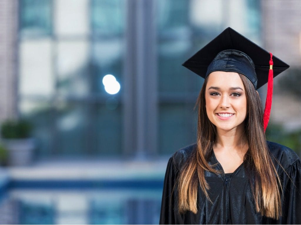 young woman graduating image